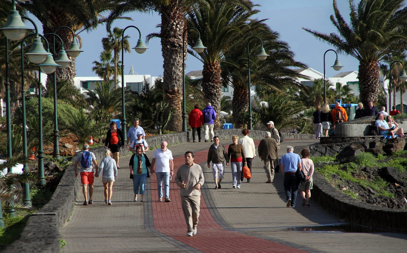 Costa Teguise beach and seafront promenade on a clear day on the east coast of Lanzarote