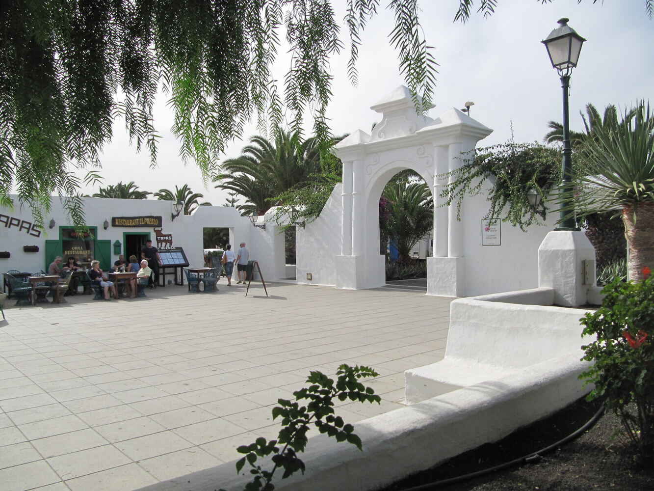 Pueblo Marinero square in Costa Teguise with families and craft market