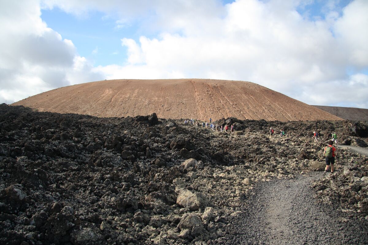 Mountain bike trail through volcanic landscape in Lanzarote