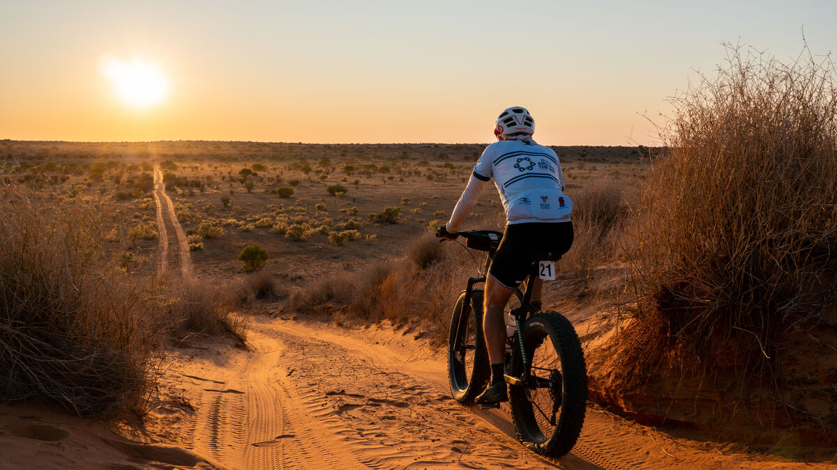 Mountain biker riding through volcanic terrain in Lanzarote