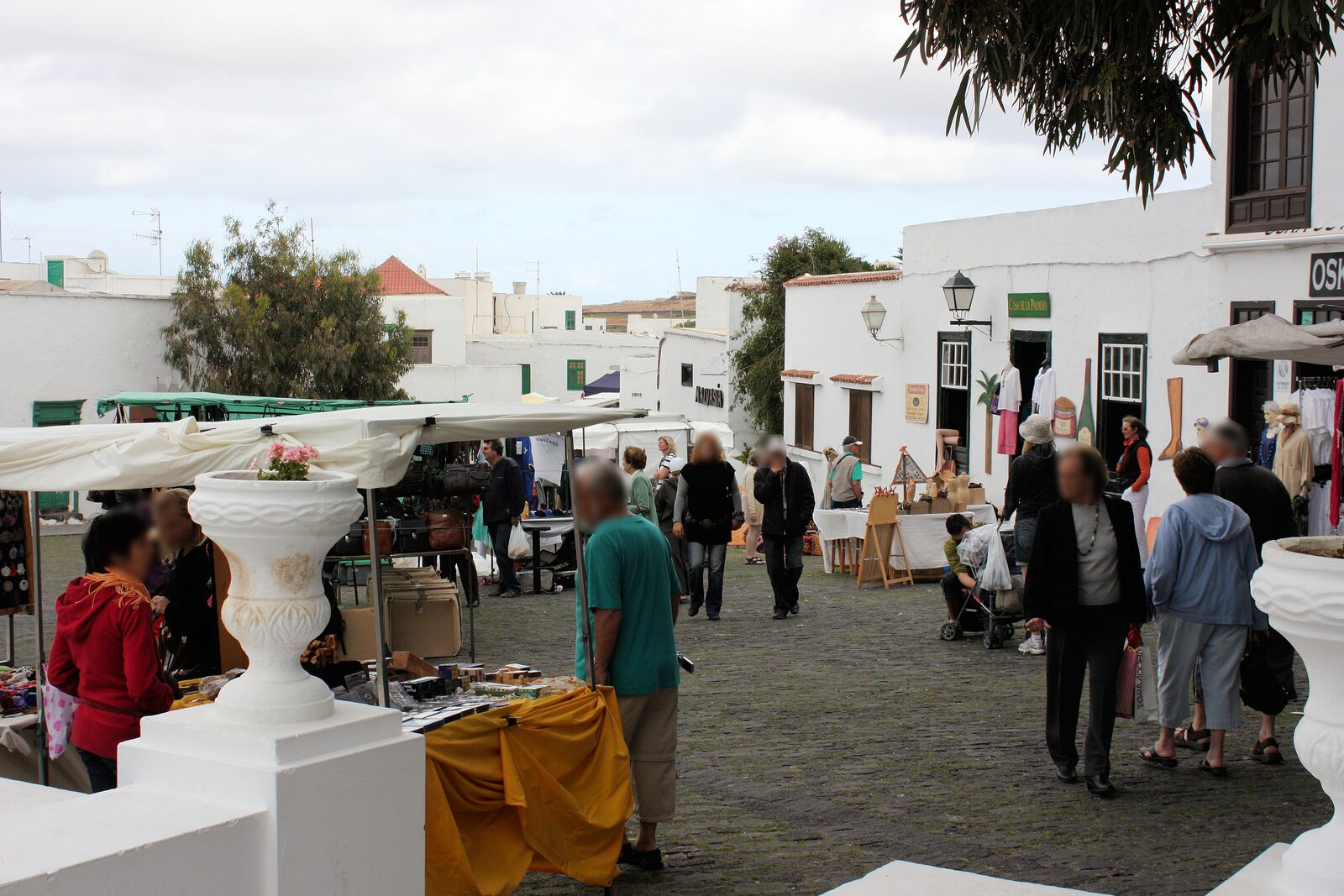 Whitewashed streets of Teguise filled with Sunday market stalls and visitors, Lanzarote