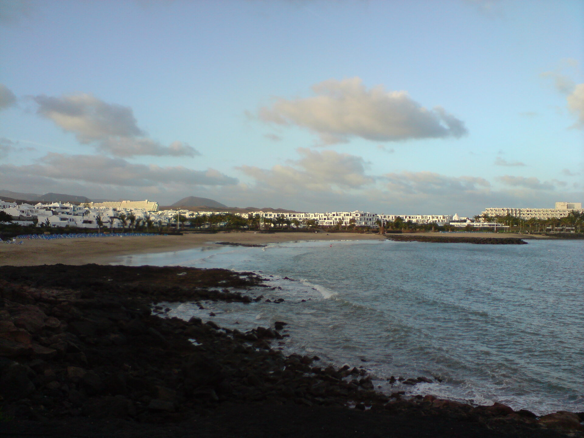 Sails on the water at Playa de las Cucharas, Costa Teguise, on a windy summer afternoon
